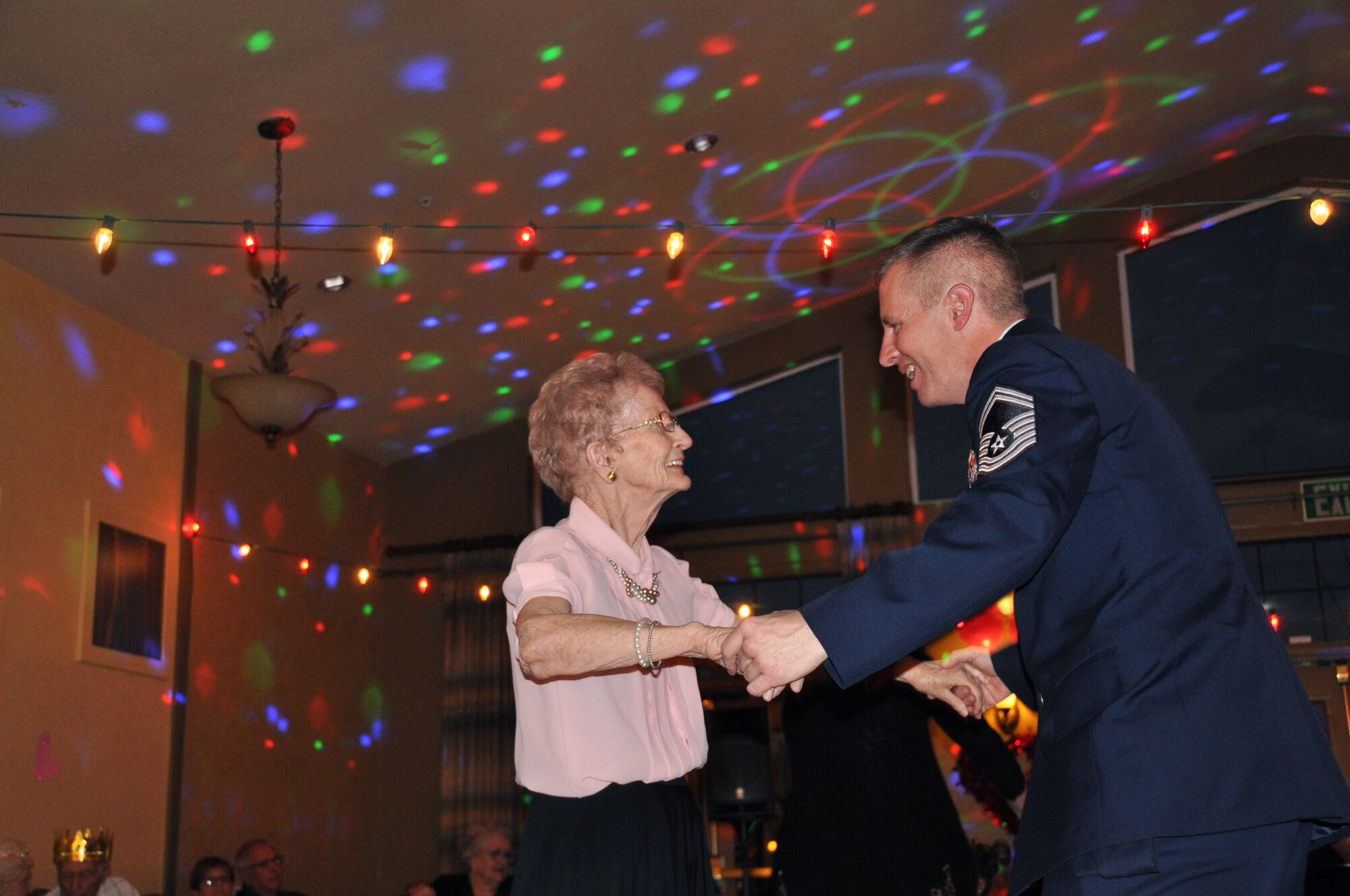 Senior Master Sgt. Brian Christensen, 419th Aircraft Maintenance Squadron, dances with Maxine, a resident of Chancellor Gardens, during the assisted living facility’s Valentine’s Day dance Feb. 9. Several Airmen from the 419th Fighter Wing and their families volunteered to be dance partners for the evening. (U.S. Air Force photo/Bryan Magaña)