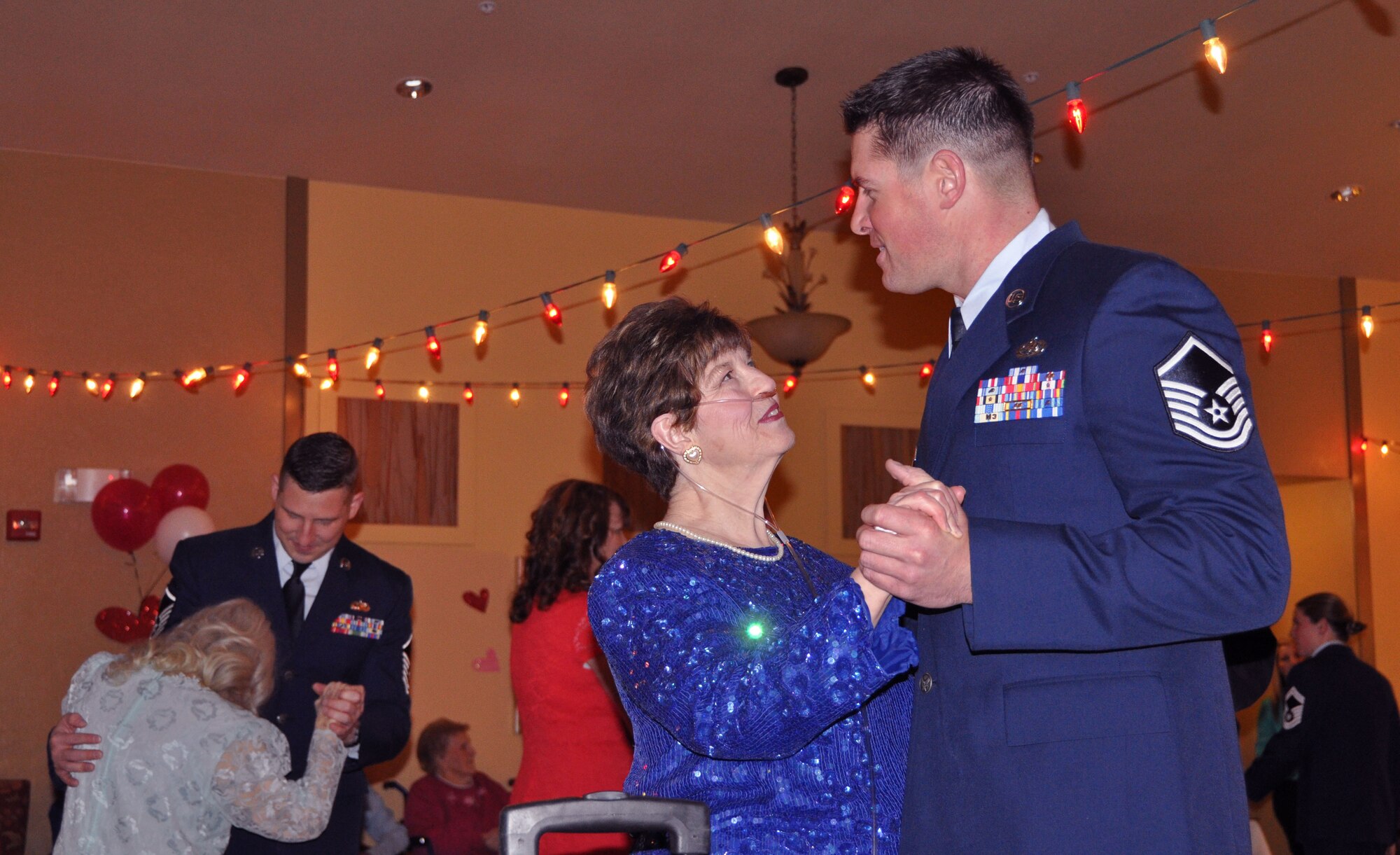 Master Sgt. Rob Scheifl, 419th Maintenance Squadron, dances with Diane, a resident of Chancellor Gardens, during the assisted living facility’s Valentine’s Day dance Feb. 9. Several Airmen from the 419th Fighter Wing and their families volunteered to be dance partners for the evening. (U.S. Air Force photo/Bryan Magaña)
