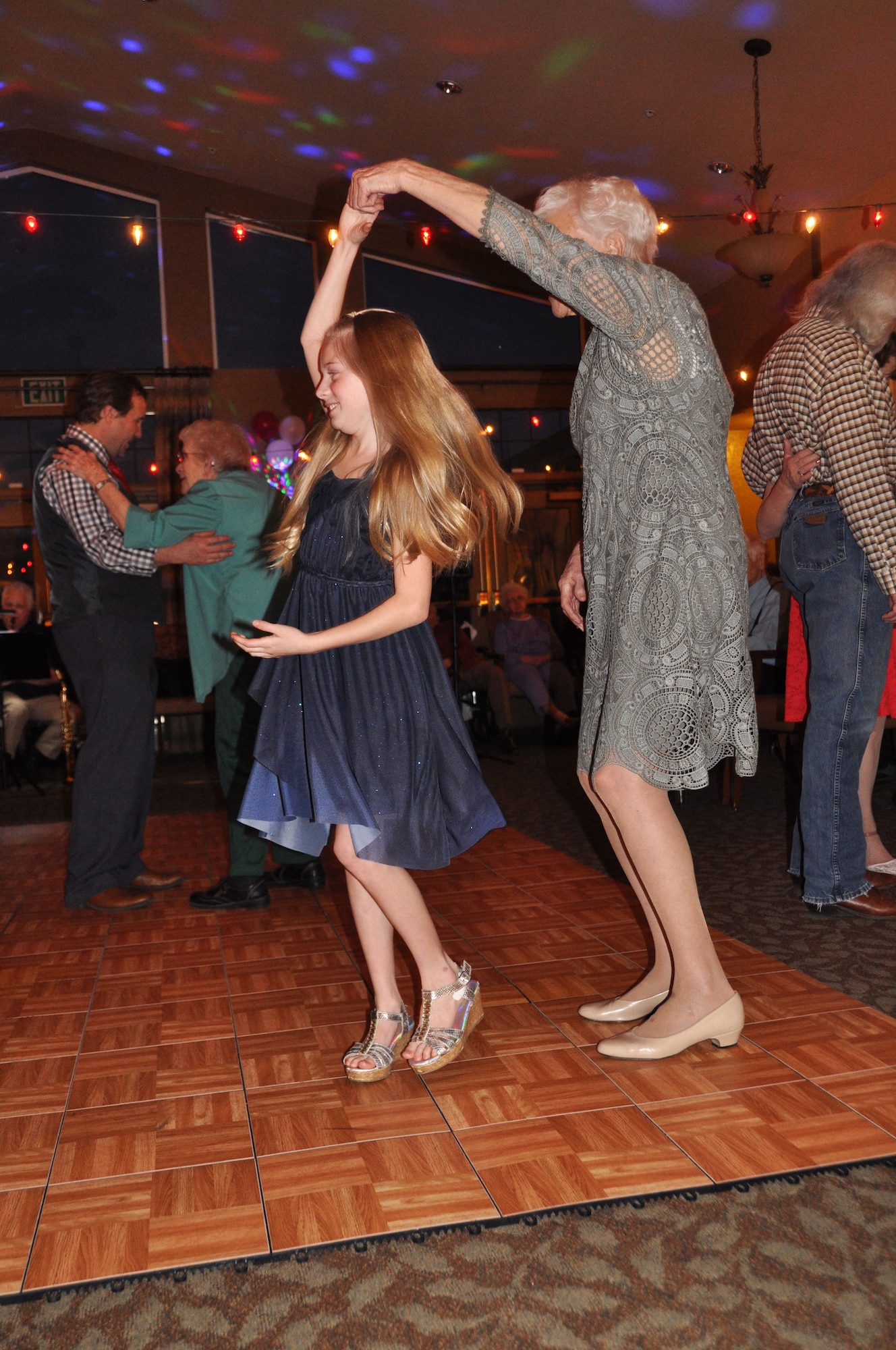 Barbara, a resident of Chancellor Gardens, twirls Kairi Rothwell, daughter of Senior Master Sgt. Jamie Hamilton, during at Valentine’s Day dance at the Clearfield assisted living facility Feb. 9. Several Airmen from the 419th Fighter Wing and their families volunteered to be dance partners for the evening. (U.S. Air Force photo/Bryan Magaña)
