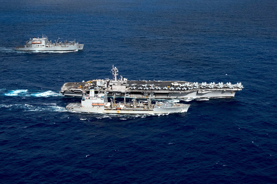 The aircraft carrier USS Carl Vinson participates in a dual replenishment-at-sea with the Military Sealift Command dry cargo and ammunition ship USNS Charles Drew, rear, and the fleet replenishment oiler USNS Pecos, foreground, in the Pacific Ocean, Feb. 3, 2017. Navy photo by Petty Officer 3rd Class Matt Brown