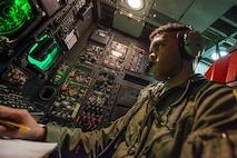 1st Lt Nathan Fisher, 23rd Bomb Squadron weapons system officer, analyses an offensive avionics system inside a B-52H Stratofortress above North Dakota, Jan. 31, 2017. Fisher along with another weapons system officer, sit in the offense compartment of the aircraft, controlling the B-52’s weapons capabilities. (U.S. Air Force photo/Senior Airman J.T. Armstrong)