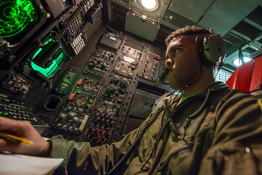 1st Lt Nathan Fisher, 23rd Bomb Squadron weapons system officer, analyses an offensive avionics system inside a B-52H Stratofortress above North Dakota, Jan. 31, 2017. Fisher along with another weapons system officer, sit in the offense compartment of the aircraft, controlling the B-52’s weapons capabilities. (U.S. Air Force photo/Senior Airman J.T. Armstrong)