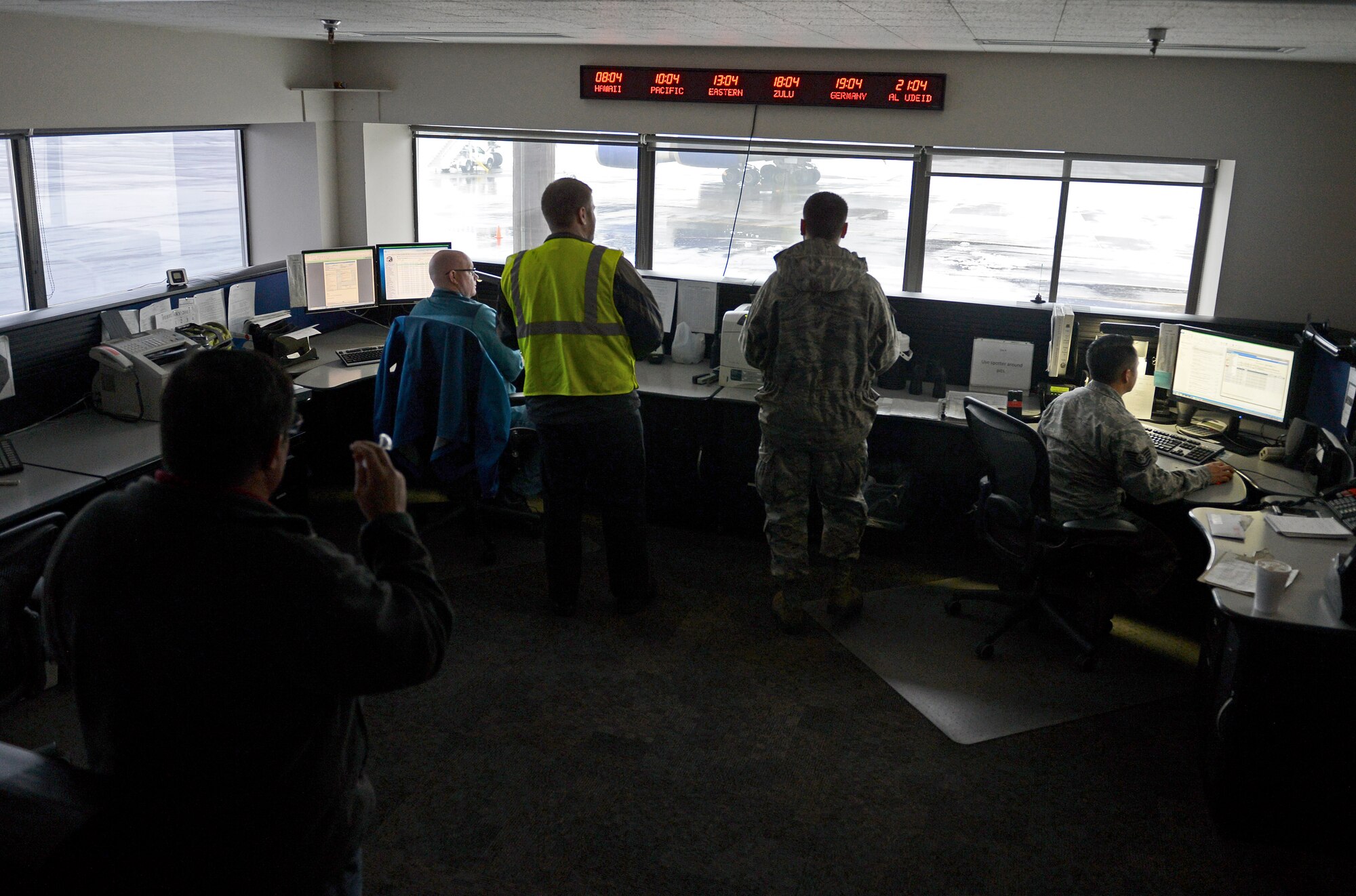 Members of the 62nd Aerial Port Squadron Air Terminal Operations Center, monitor activity on the flightline Feb. 8, 2017 at Joint Base Lewis-McChord, Wash. ATOC coordinates all outside requests for agency support and information and distributes them to the different sections throughout the aerial port for proper coordination. (U.S. Air Force photo/Senior Airman Divine Cox)