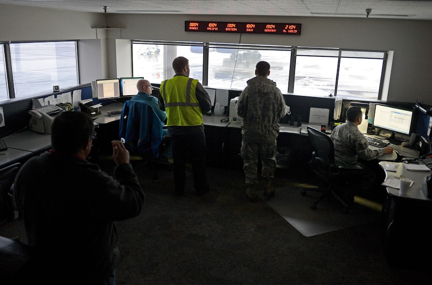 Members of the 62nd Aerial Port Squadron Air Terminal Operations Center, monitor activity on the flightline Feb. 8, 2017 at Joint Base Lewis-McChord, Wash. ATOC coordinates all outside requests for agency support and information and distributes them to the different sections throughout the aerial port for proper coordination. (U.S. Air Force photo/Senior Airman Divine Cox)