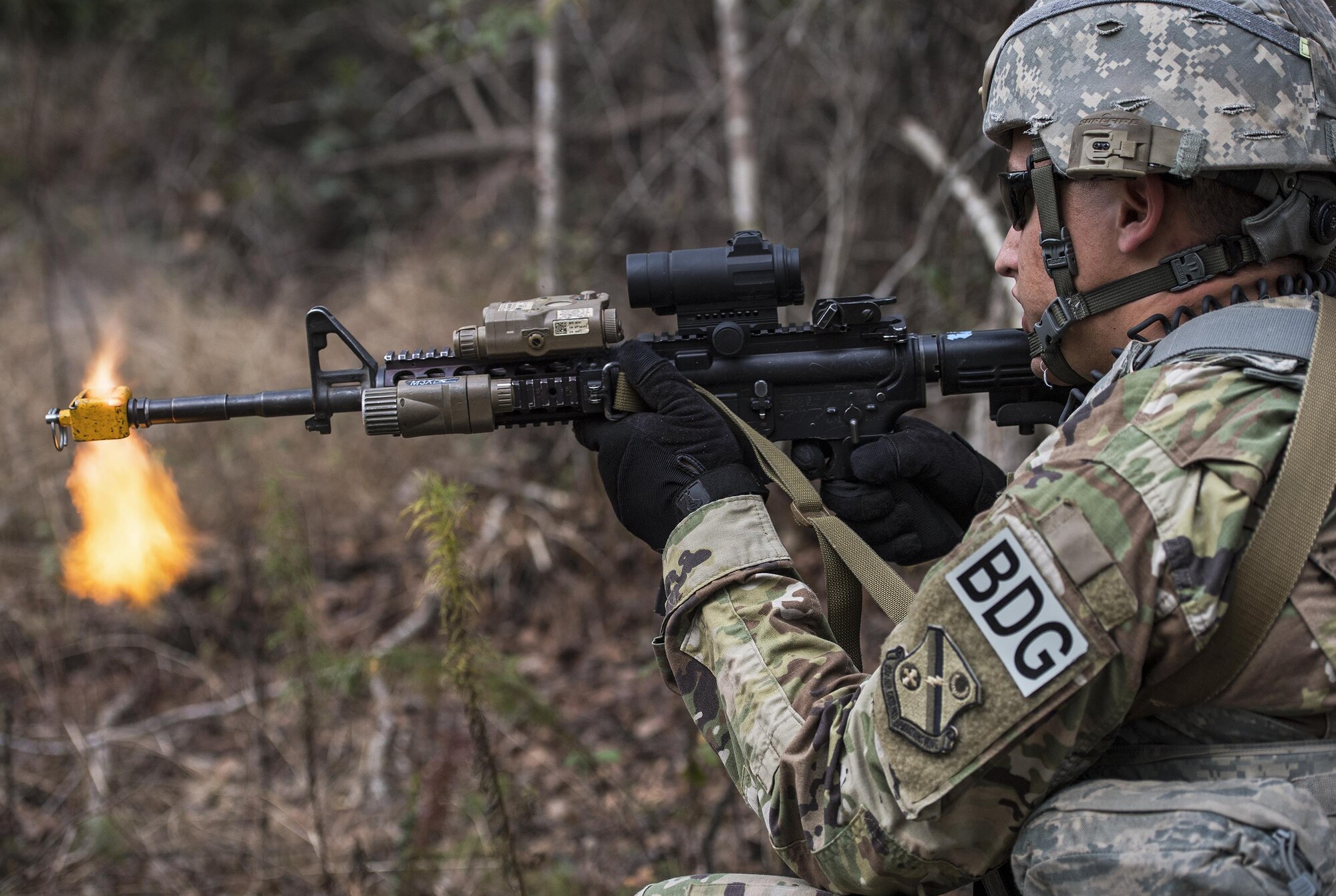 Staff Sgt. Christopher Elliott, 822d Base Defense Squadron fireteam leader, returns fire during an ambush, while simulating patrolling an area outside the wire Feb. 7, 2017, at Moody Air Force Base, Ga. After ensuring all simulated hostile forces were down, Airmen relayed information gathered during the battle to the Tactical Operation Center and awaited further instruction. (U.S. Air Force photo by Airman 1st Class Janiqua P. Robinson)