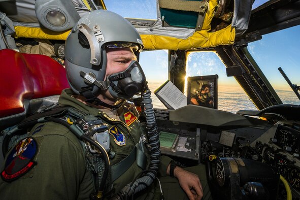 Capt. Dane Weathers, 23rd Bomb Squadron aircraft commander, pilots a B-52H Stratofortress above the clouds in North Dakota airspace, Jan. 31, 2017. Weathers and Capt. Jonathan Gabriel, 23rd BS aircraft commander, relied on their offensive and defensive team to successfully complete their training mission. (U.S. Air Force photo/Senior Airman J.T. Armstrong)