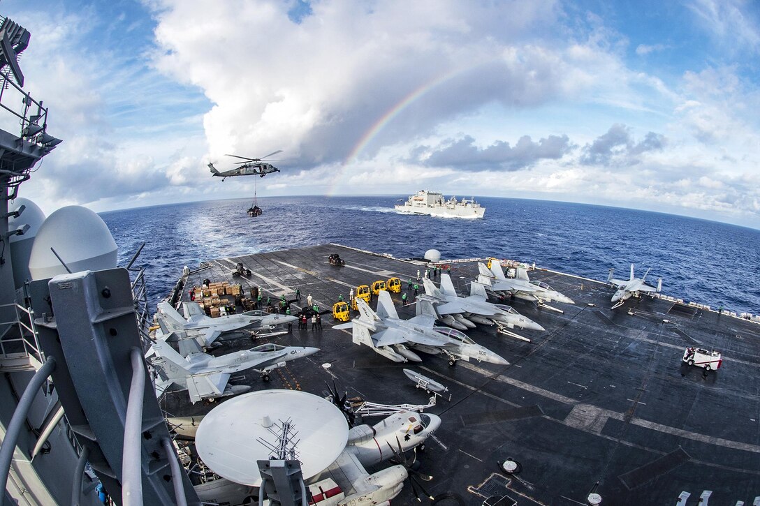 The aircraft carrier USS Carl Vinson participates in a vertical replenishment with Helicopter Sea Combat Squadron 4 and the Military Sealift Command dry cargo and ammunition ship USNS Charles Drew in the Pacific Ocean, Feb. 3, 2017. The Vinson is part of the U.S. Pacific Fleet-led initiative to extend the command and control functions of U.S. 3rd Fleet. Navy photo by Petty Officer 2nd Class Sean M. Castellano