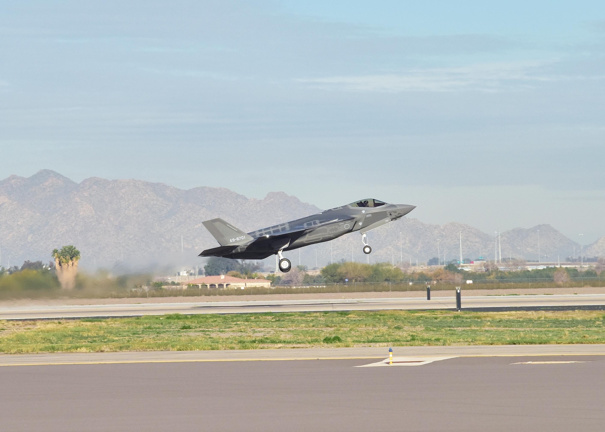 An F-35A flown by Lt. Col. Nakano, Japan Air Self-Defense Force national representative pilot to Luke, departs Feb. 7 on his first solo sortie at Luke Air Force Base, Ariz. (U.S. Air Force photo taken by Tech. Sgt. Louis Vega Jr.)