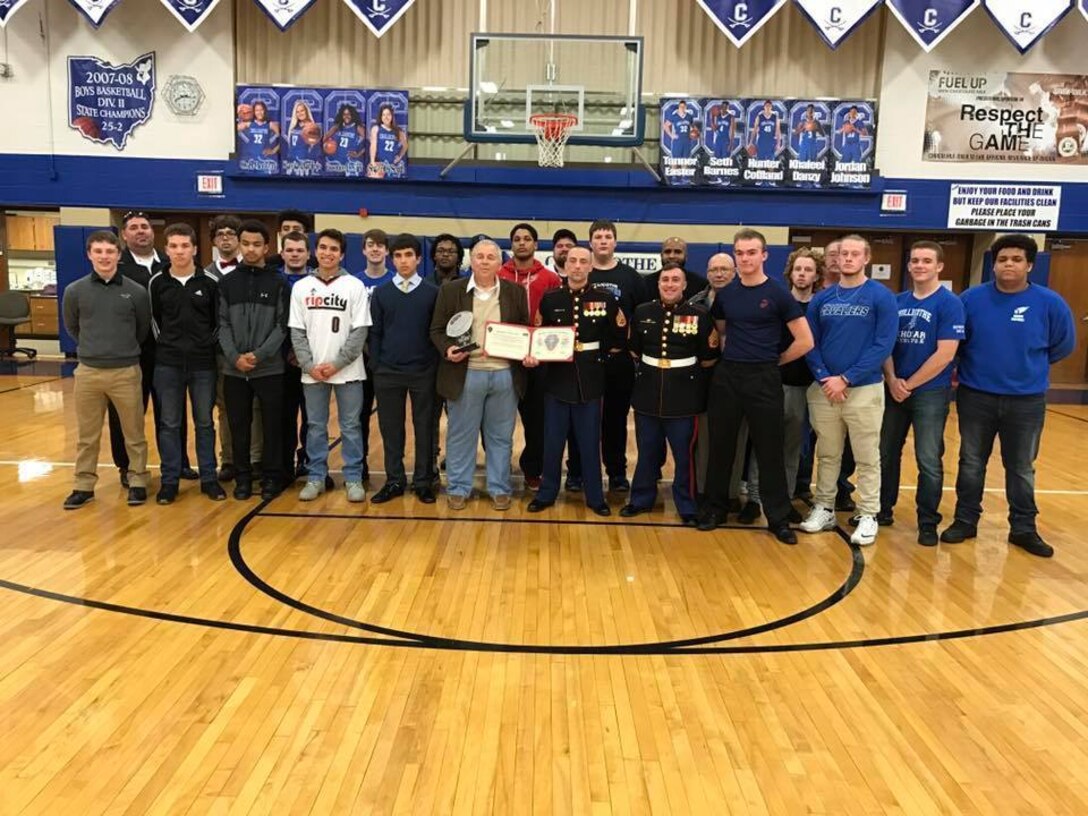 Chillicothe High School head football coach Ron Hinton was awarded the 2017 Semper Fi Coach's award by U.S. Marines with Recruiting Sub-Station Circleville Feb. 7, 2017, during halftime of the Chillicothe Cavaliers boys' varsity basketball game. The Semper Fi Coach Award recognizes a high school football coach who exemplifies the Marine Corps motto: Semper Fidelis – always faithful. It is earned by a coach who models the Marine Corps leadership values of honor, courage, and commitment. Hinton is the only coach to receive the award from Marine Corps Recruiting Station Charleston, which covers much of Tennessee, West Virginia, Virginia, Ohio and Kentucky.  (U.S. Marine Corps photo by Sgt. Caitlin Brink/Released)