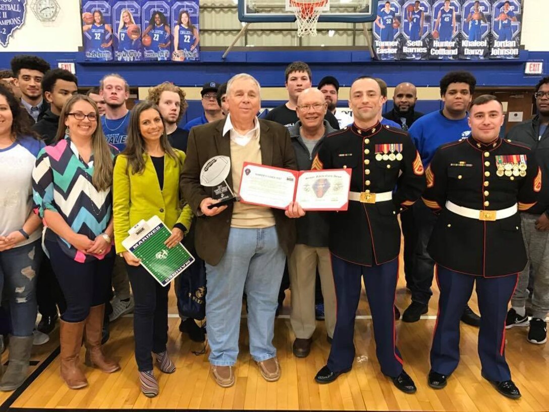 Chillicothe High School head football coach Ron Hinton was awarded the 2017 Semper Fi Coach's award by U.S. Marines with Recruiting Sub-Station Circleville Feb. 7, 2017, during halftime of the Chillicothe Cavaliers boys' varsity basketball game. The Semper Fi Coach Award recognizes a high school football coach who exemplifies the Marine Corps motto: Semper Fidelis – always faithful. It is earned by a coach who models the Marine Corps leadership values of honor, courage, and commitment. Hinton is the only coach to receive the award from Marine Corps Recruiting Station Charleston, which covers much of Tennessee, West Virginia, Virginia, Ohio and Kentucky.  (U.S. Marine Corps photo by Sgt. Caitlin Brink/Released)