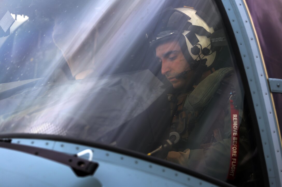 Capt. Benjamin Ables conducts a pre-flight check before taking off aboard Marine Corps Air Station New River, N.C., Feb. 9, 2017. MV-22 Osprey pilots conduct training daily in order to remain proficient in their technically demanding job. Typically, Osprey pilots conduct missions such as transporting external loads, aerial deliveries, low altitude tactics and putting troops on the ground. Ables is a pilot with Marine Medium Tiltrotor Squadron 263, Marine Aircraft Group 26, 2nd Marine Aircraft Wing. (U.S. Marine Corps Photo by Cpl. Mackenzie Gibson/Released)