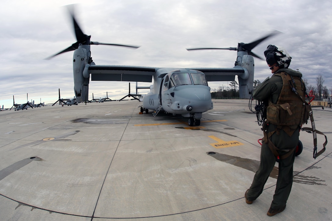 Sgt. Brett Hankins watches his surroundings as an MV-22 Osprey prepares for flight aboard Marine Corps Air Station New River, N.C., Feb. 9, 2017. The crew chief is in charge of being aware of their surrounds at all times to give the pilot proper direction when conducting flight operations. The pilots and crew chiefs rely on each other to complete their mission objectives. Hankins is a crew chief the Marine Medium Tiltrotor Squadron 263, Marine Aircraft Group 26, 2nd Marine Aircraft Wing. (U.S. Marine Corps photo by Cpl. Mackenzie Gibson/Released)