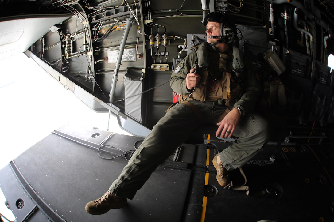 Sgt. Brett Hankins observes the skies out the back of an MV-22 Osprey as it flies near Marine Corps Air Station New River, N.C., Feb. 9, 2017. Many operations are intensive on Osprey pilots such as aerial refueling, but some flight operations such as external lifts require the pilots to rely on the crew chief. This makes them an essential part to mission accomplishment. Hankins is a crew chief with Marine Medium Tiltrotor Squadron 263, Marine Aircraft Group 26, 2nd Marine Aircraft Wing. (U.S. Marine Corps photo by Cpl. Mackenzie Gibson/Released)