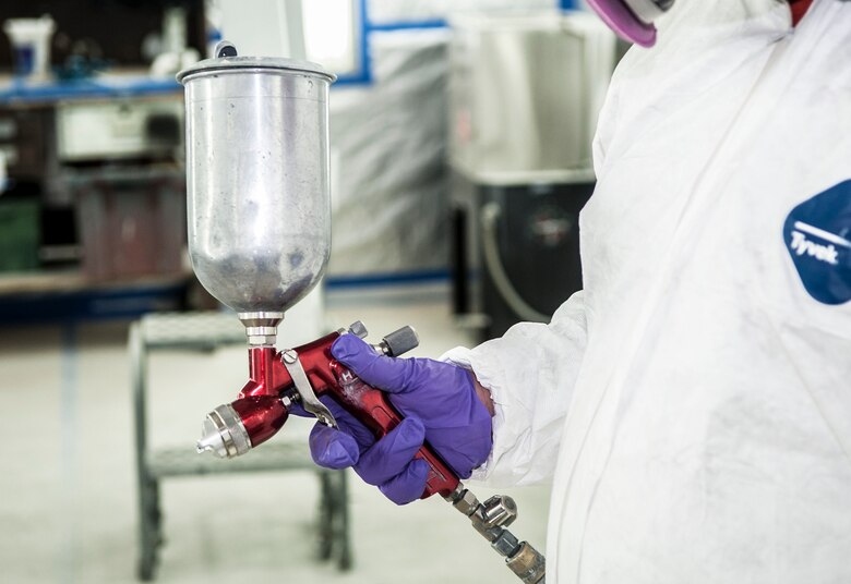 A member of the 91st Missile Maintenance Squadron corrosion control team holds a paint spray gun at Minot Air Force Base, N.D., Feb. 2, 2017. The team is responsible for removing all corrosion and repainting various pieces of equipment used at 91st Missile Wing missile sites. (U.S. Air Force photo/Airman 1st Class Jonathan McElderry)