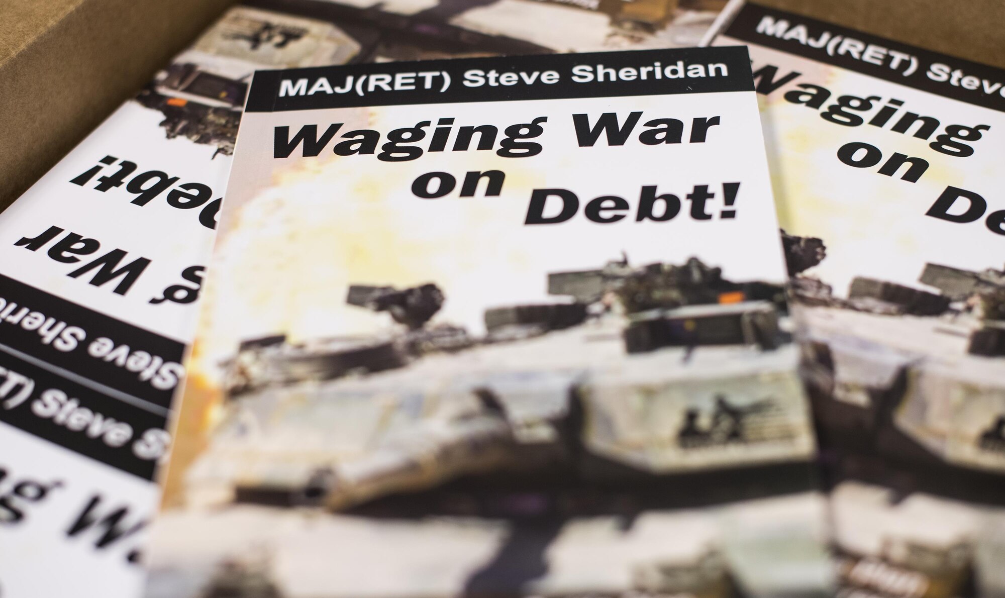 Books rest on a table during the “Waging War on Debt” seminar Feb. 10, 2017, at Moody Air Force Base, Ga. The seminar was open to all military members and taught money saving techniques and planning for financial freedom. (U.S. Air Force Senior Airman Ceaira Young)