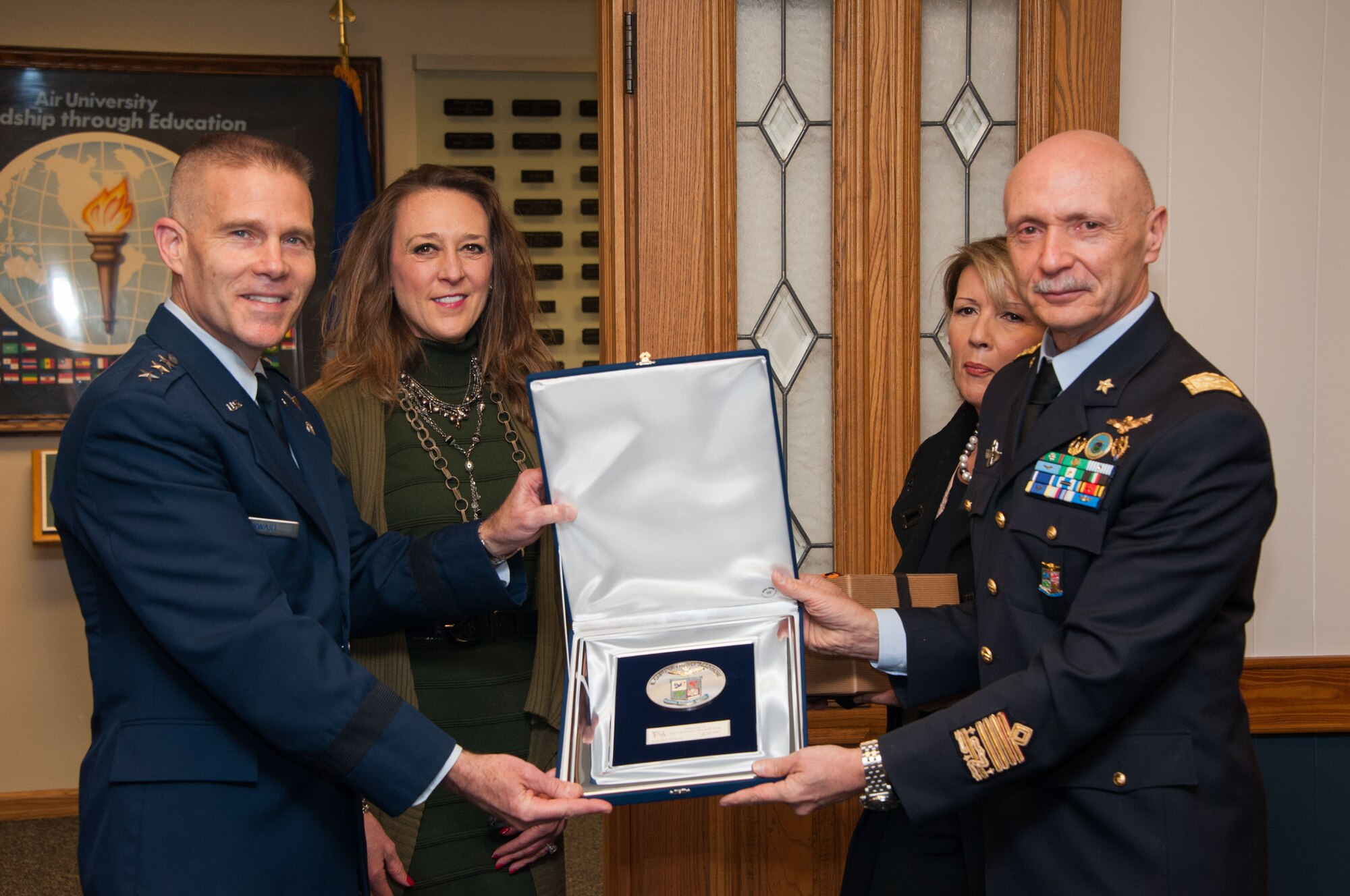Lt. Gen. Steven Kwast, Commander and President of Air University, presents a plaque to Lt. Gen. Enzo Vecciarelli, Chief of Staff of the Italian Air Force, during the International Honor Roll Induction Ceremony on Maxwell Air Force Base, Ala., Feb. 10, 2017. The IHR program facilitates senior-leader military engagement with international partners and creates an environment of prestige for graduates of AU programs. (US Air Force photo by Bud Hancock)