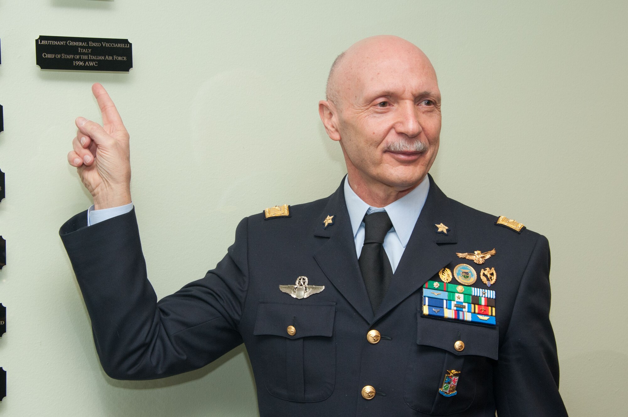 Lt. Gen. Enzo Vecciarelli, Chief of Staff of the Italian Air Force, points to his name on the International Officer Honor Roll wall on Maxwell Air Force Base, Ala., Feb. 10, 2017. Vecciarelli is one of more than 400 officers from 97 countries who have been inducted as of 2017. (US Air Force photo by Bud Hancock)