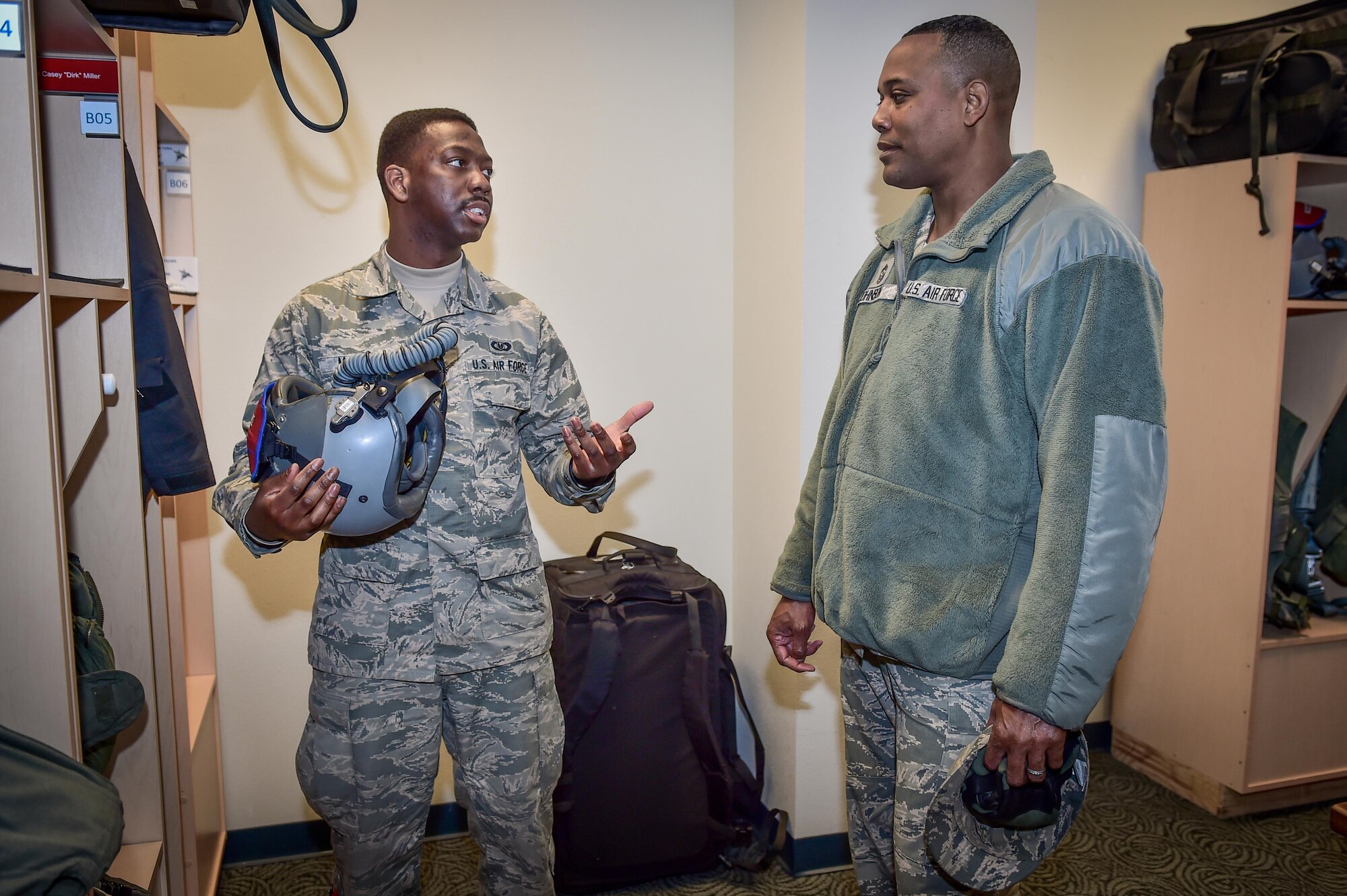 U.S. Air Force Staff Sgt. Richard Miller, assigned to the 3rd Operations Support Squadron, left, talks with Chief Master Sgt. Anthony Johnson, Pacific Air Forces (PACAF) command chief, at the 525th Fighter Squadron on Joint Base Elmendorf-Richardson, Alaska, as Johnson toured the base, Feb. 7, 2017. PACAF leadership toured various facilities throughout the installation to meet with Airmen and get a first-hand look at the broad spectrum of JBER mission sets.