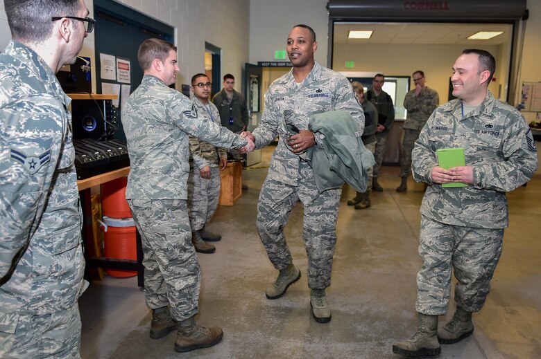 U.S. Air Force Chief Master Sgt. Anthony Johnson, Pacific Air Forces (PACAF) command chief, interacts with Airmen at the 525th Fighter Squadron on Joint Base Elmendorf-Richardson, Alaska, as he toured the base, Feb. 7, 2017. PACAF leadership toured various facilities throughout the installation to meet with Airmen and get a first-hand look at the broad spectrum of JBER mission sets.