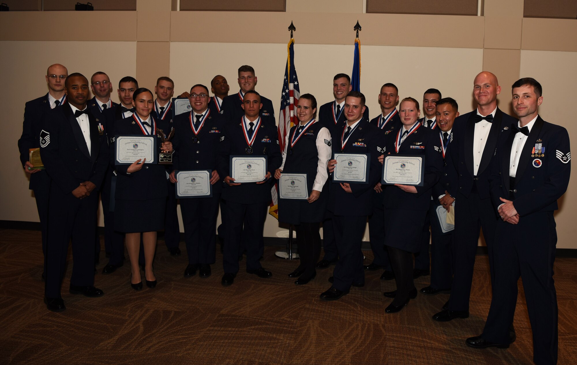 Airman Leadership School class 17-B stand together one last time after their graduation Feb. 9, 2017, at the Leadership Develop Center on Buckley Air Force Base, Colo. The students of ALS learn valuable skills necessary for all supervisory roles within the Air Force. (U.S. Air Force photo by Airman Holden S. Faul/Released)