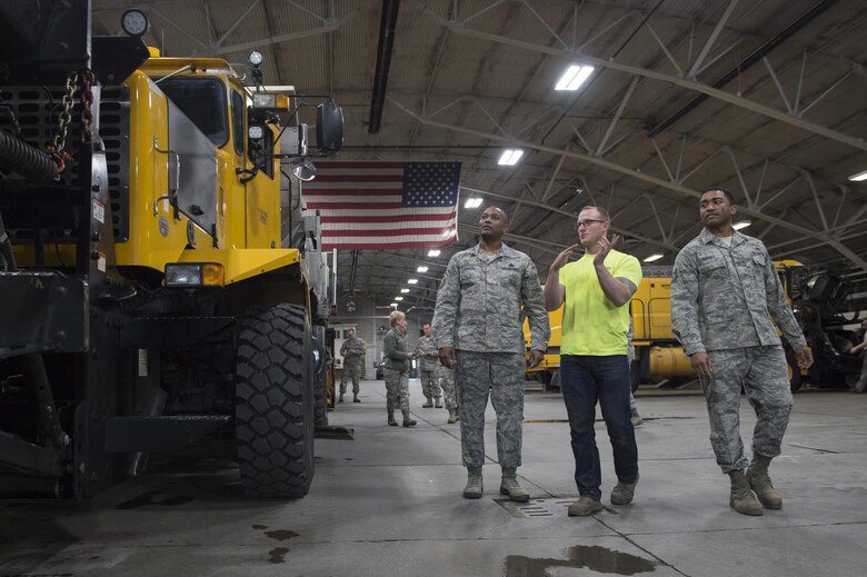 U.S. Air Force Chief Master Sgt. Anthony Johnson, left, Pacific Air Forces (PACAF) command chief, inspects snow removal vehicles belonging to the 773rd Civil Engineer Squadron while touring Joint Base Elmendorf-Richardson, Alaska, Feb. 7, 2017. PACAF leadership toured various facilities throughout the installation to meet with Airmen and get a first-hand look at the broad spectrum of JBER mission sets. 