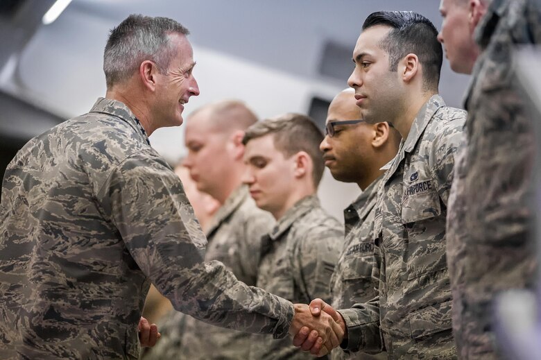 U.S. Air Force Gen. Terrence J. O'Shaughnessy, Pacific Air Forces commander, presents a commander’s coin to outstanding Airmen during an all-call at Joint Base Elmendorf- Richardson, Alaska, Feb. 7, 2017. During the all-call, O’Shaughnessy spoke to Airmen about several topics including leadership philosophies, command priorities, and what Airmen can expect from him as well as what he expects from them. 