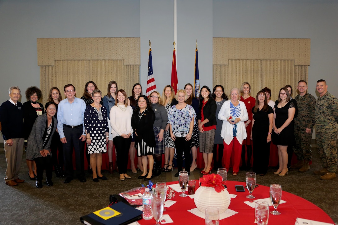 Navy-Marine Corps Relief Society volunteers were recognized during an annual banquet for taking care of Marines and Sailors aboard Marine Corps Air Station Cherry Point, N.C., Feb. 9, 2017. The mission of the society is to provide financial, educational and other need-based assistance to active-duty or retired Marines and Sailors, their eligible family members, and survivors. (U.S. Marine Corps photo by Cpl. Jason Jimenez/ Released)