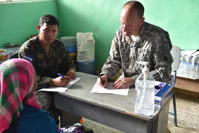 Patients wait outside a school in Estancia, La Paz, to receive basic medical care from a team of Honduran and U.S. personnel during a two-day Medical Readiness Training Exercise, Jan. 31. Personnel from the Joint Task Force-Bravo Medical Element worked side by side with local nurses and physicians, as well as Honduran soldiers to provide the population with immunizations, preventive medicine, dental services, basic medical care and pharmacy services. (U.S. Army photo by Maria Pinel)