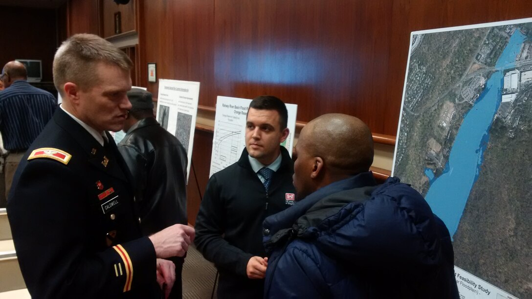 Col. David A. Caldwell, commander, U.S. Army Corps of Engineers, New York District (left), Robert Vohden, real estate specialist, U.S. Army Corps of Engineers, New York District (right), engage in discussions with residents in the study area of the Rahway River Basin Flood Risk Management Study, in Orange, N.J. January 26, 2017. 