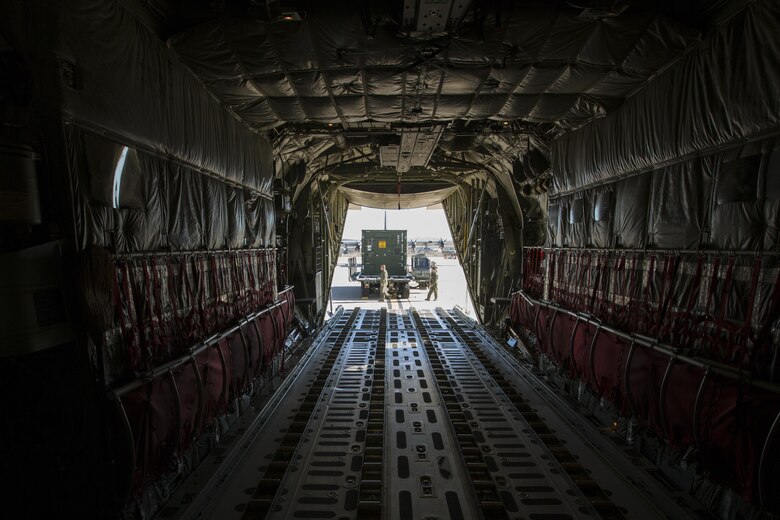 U.S. Marine Corps load masters with Marine Aerial Refueler Transport Squadron (VMGR) 352 load the 3d Marine Aircraft Wing Combat Camera Tactical Imagery Production System (TIPS) onto a KC-130 during Loading Exercise (LOADEX) 2015 aboard Marine Corps Air Station Miramar, San Diego, Calif., Nov. 20, 2015. The LOADEX provided the opportunity to develop 3d Marine Aircraft Wing Combat Camera Standard Operating Procedures to ensure TIPS air transport readiness. (U.S. Marine Corps photo by Lance Cpl. Nathaniel Castillo/Released)