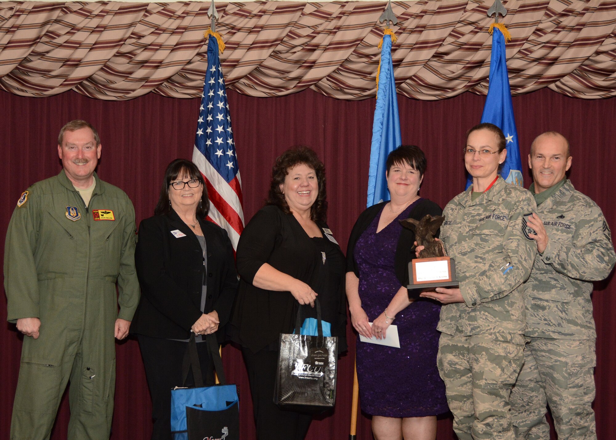 Master Sgt. Kimberlee Koldste, 1st Sgt. for the 507th Aircraft Maintenance Squadron, accepts her award for the 507th Air Refueling Wing 1st Sgt. of the Year Feb. 4, 2017, in the Tinker Club Ballroom at Tinker Air Force Base, Okla. Col. Doug Gullion, 507th Air Refueling Wing commander, Jan Davis, assistant vice president and branch manager of Tinker Federal Credit Union, Kathy Gillette, president and CEO of the Moore Chamber of Commerce, Tanya Windisch, assistant branch manager of Tinker Federal Credit Union and Chief Master Sgt. Stephen Brown, 507th ARW command chief, were on hand to present the award. (U.S. Air Force photo/Tech. Sgt. Lauren Gleason)
