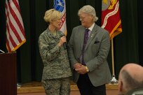 U.S. Air Force Brig. Gen. Heather Pringle, 502nd Air Base Wing and Joint Base San Antonio commander, speaks with Retired U.S. Navy Petty Officer 3rd Class Dave Roever, a Vietnam veteran and Purple Heart recipient, after he spoke about his experiences during Vietnam and after during the 2017 JBSA Prayer Breakfast at Gateway Club at JBSA-Lackland, Texas, Feb. 7, 2017.