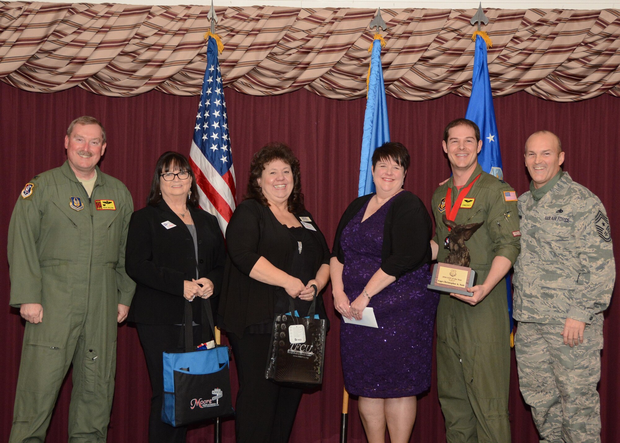 Capt. Christopher Nutt of the 465th Air Refueling Squadron accepts his award for the 507th Air Refueling Wing Company Grade Officer of the Year Feb. 4, 2017, in the Tinker Club Ballroom at Tinker Air Force Base, Okla. Col. Doug Gullion, 507th Air Refueling Wing commander, Jan Davis, assistant vice president and branch manager of Tinker Federal Credit Union, Kathy Gillette, president and CEO of the Moore Chamber of Commerce, Tanya Windisch, assistant branch manager of Tinker Federal Credit Union and Chief Master Sgt. Stephen Brown, 507th ARW command chief, were on hand to present the award. (U.S. Air Force photo/Tech. Sgt. Lauren Gleason)