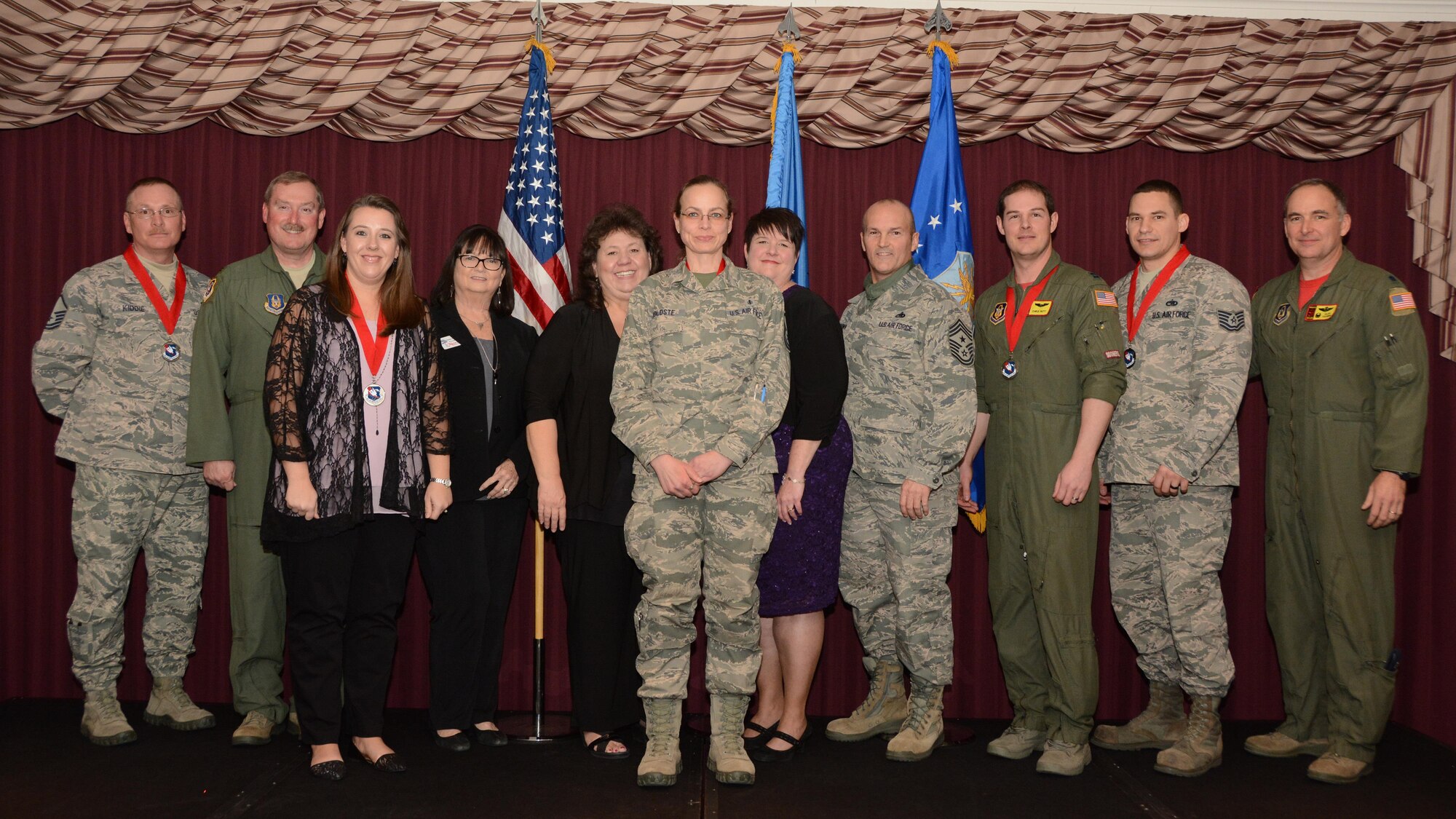 507th Air Refueling Wing’s 2016 annual award winners: Master Sgt. Eric Kiddie of the 507th Security Forces Squadron, Col. Doug Gullion, 507th Air Refueling Wing commander, Mrs. Tara Randol, wife of Master Sgt. James Randol of the 507th Civil Engineer Squadron, Jan Davis, assistant vice president and branch manager of Tinker Federal Credit Union, Kathy Gillette, president and CEO of the Moore Chamber of Commerce, Master Sgt. Kimberlee Koldste, 1st Sgt. for the 507th Aircraft Maintenance Squadron, Tanya Windisch, assistant branch manager of Tinker Federal Credit Union, Chief Master Sgt. Stephen Brown, 507th ARW command chief, Capt. Christopher Nutt of the 465th Air Refueling Squadron, Tech. Sgt. Bradley Block of the 507th Maintenance Squadron and Lt. Col. Cliffton Vaughn, 465th Air Refueling Squadron commander, representing 507th Operations Group’s winners not in attendance: Senior Airman Richard Franz, Tech. Sgt. Sarah Plueger and Mrs. Rachael Garrison. (U.S. Air Force photo/Tech. Sgt. Lauren Gleason)