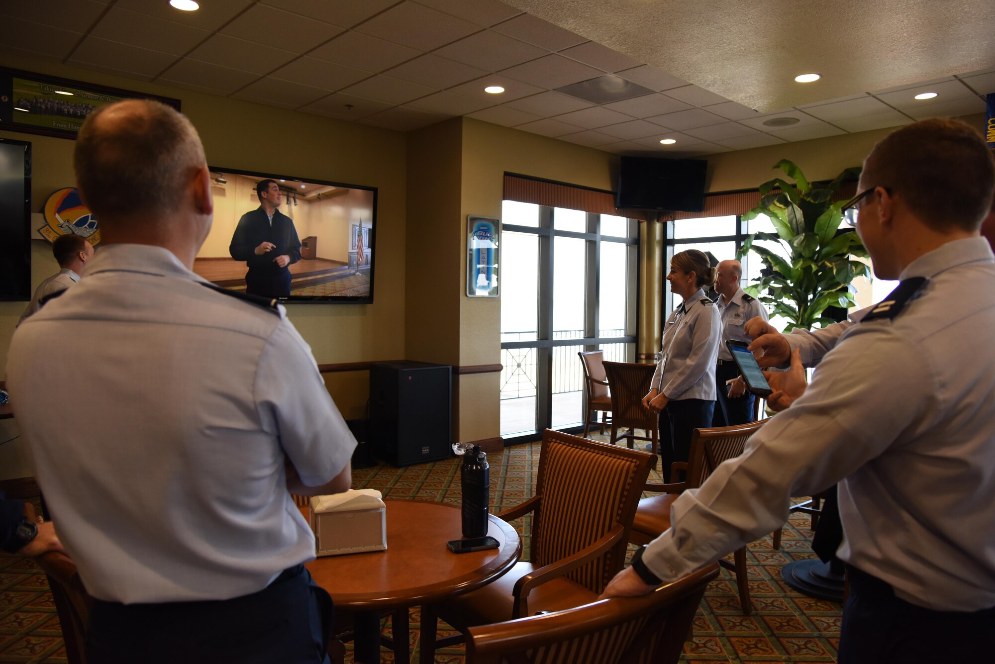 Col. Michele Edmondson, 81st Training Wing commander, watches a live multimedia broadcast system demonstration at the Bay Breeze Event Center Feb. 6, 2017, on Keesler Air Force Base, Miss. The conferencing system provides a way for someone at the BBEC to communicate with up to five locations on base via a livestream. (U.S. Air Force photo by Kemberly Groue)
