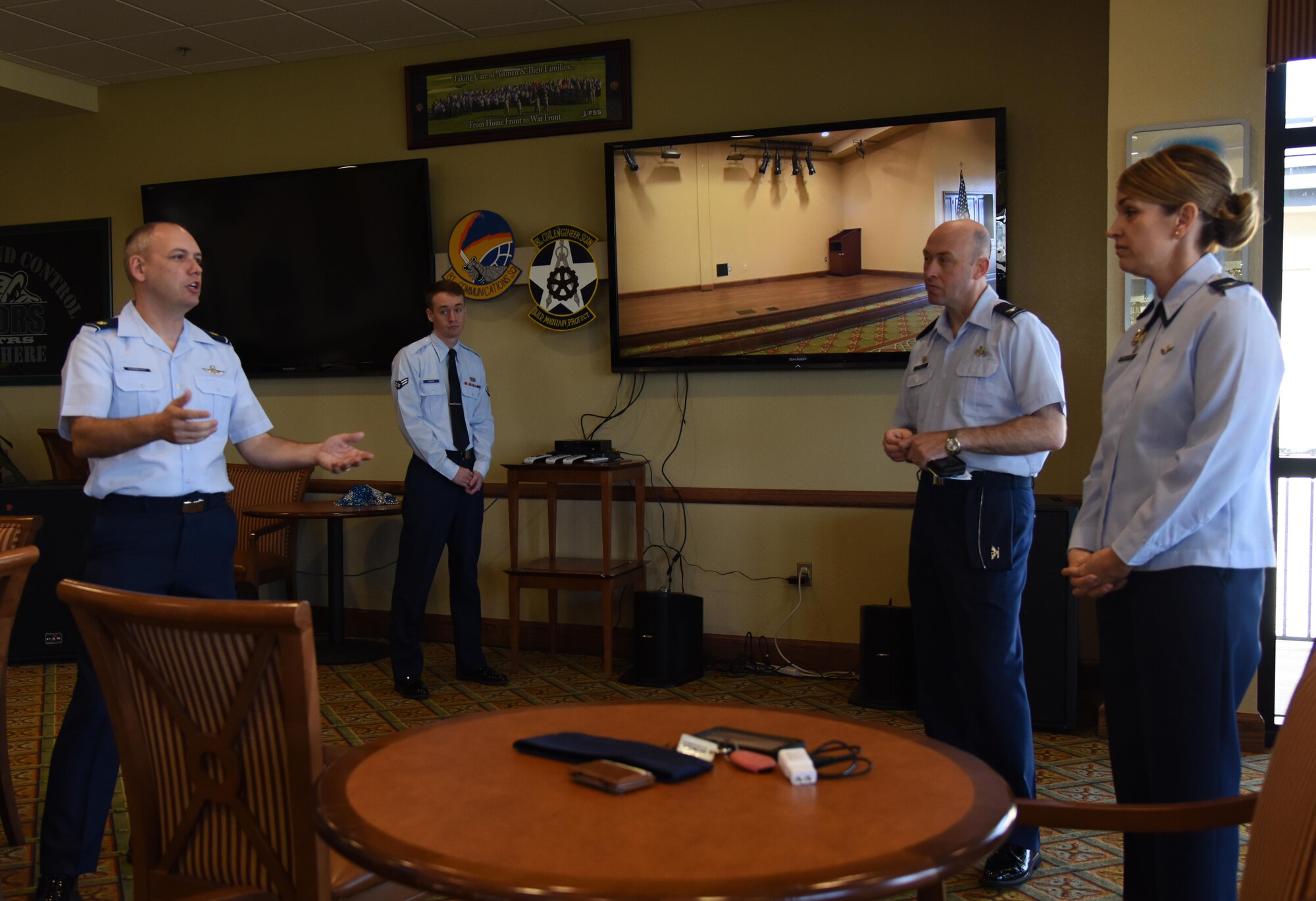 Maj. Jerry Hambright, 81st Communications Squadron commander, explains to Col. Michele Edmondson, 81st Training Wing commander, the capabilities of the live multimedia  broadcast system during a demonstration at the Bay Breeze Event Center Feb. 6, 2017, on Keesler Air Force Base, Miss. The conferencing system provides a way for someone at the BBEC to communicate with up to five locations on base via a livestream. (U.S. Air Force photo by Kemberly Groue)
