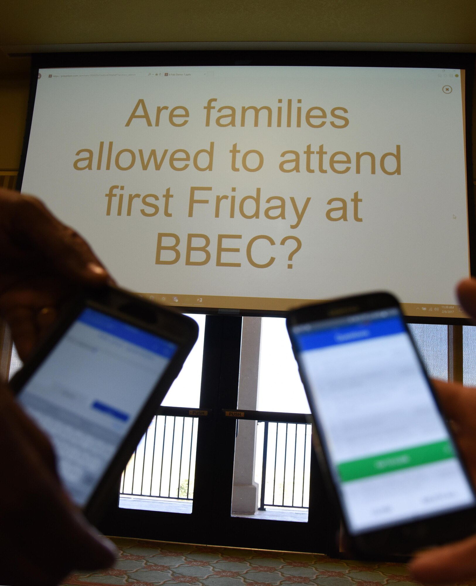 A cell phone screen displays a submitted question during a live multimedia broadcast system demonstration at the Bay Breeze Event Center Feb. 6, 2017, on Keesler Air Force Base, Miss. The conferencing system provides a way for someone at the BBEC to communicate with up to five locations on base via a livestream. (U.S. Air Force photo by Kemberly Groue)