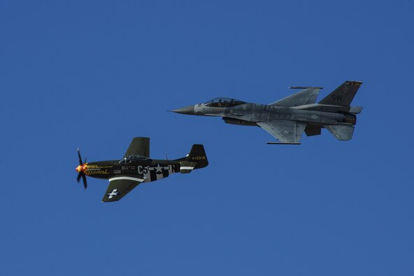 A U.S. Air Force F-16C Fighting Falcon and a P-51 Mustang fly in formation during the 2017 Heritage Flight Training and Certification Course at Davis-Monthan Air Force Base, Ariz., Feb. 10, 2017. The annual aerial demonstration training event has been held at D-M since 2001, the course featured aerial demonstrations from historical and modern fighter aircraft. (U.S. Air Force photo by Airman 1st Class Mya M. Crosby)