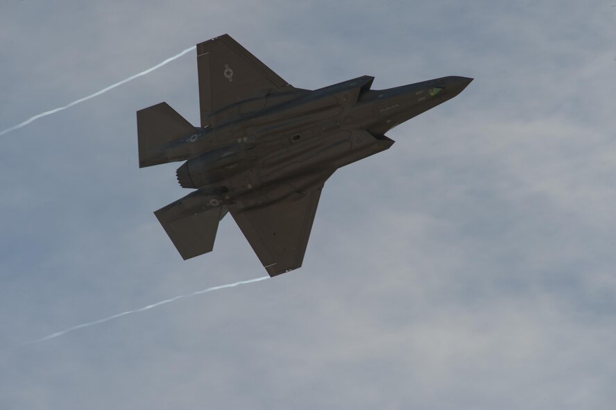 A U.S. Air Force F-35 Lightning II flies above spectators during the 2017 Heritage Flight Training and Certification Course at Davis-Monthan Air Force Base, Ariz., Feb. 9, 2017. The HFTCC provides civilian and military pilots the opportunity to practice flying in formation together in preparation for future air shows. (U.S. Air Force photo by Senior Airman Ashley N. Steffen)