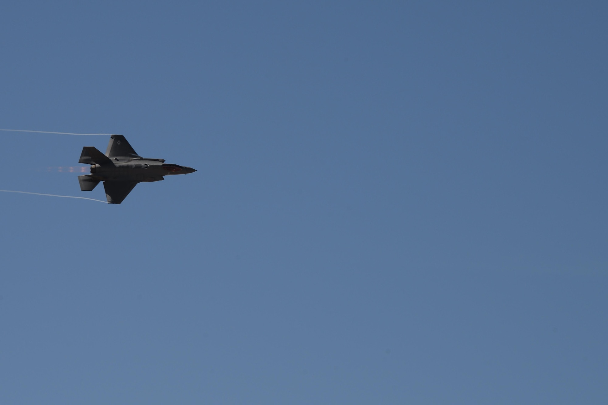 A U.S. Air Force F-35 Lightning II performs aerial maneuvers during the 2017 Heritage Flight Training and Certification Course at Davis-Monthan Air Force Base, Ariz., Feb. 10, 2017. The HFTCC provides civilian and military pilots the opportunity to practice flying in formation together in preparation for future air shows. (U.S. Air Force photo by Senior Airman Ashley N. Steffen)