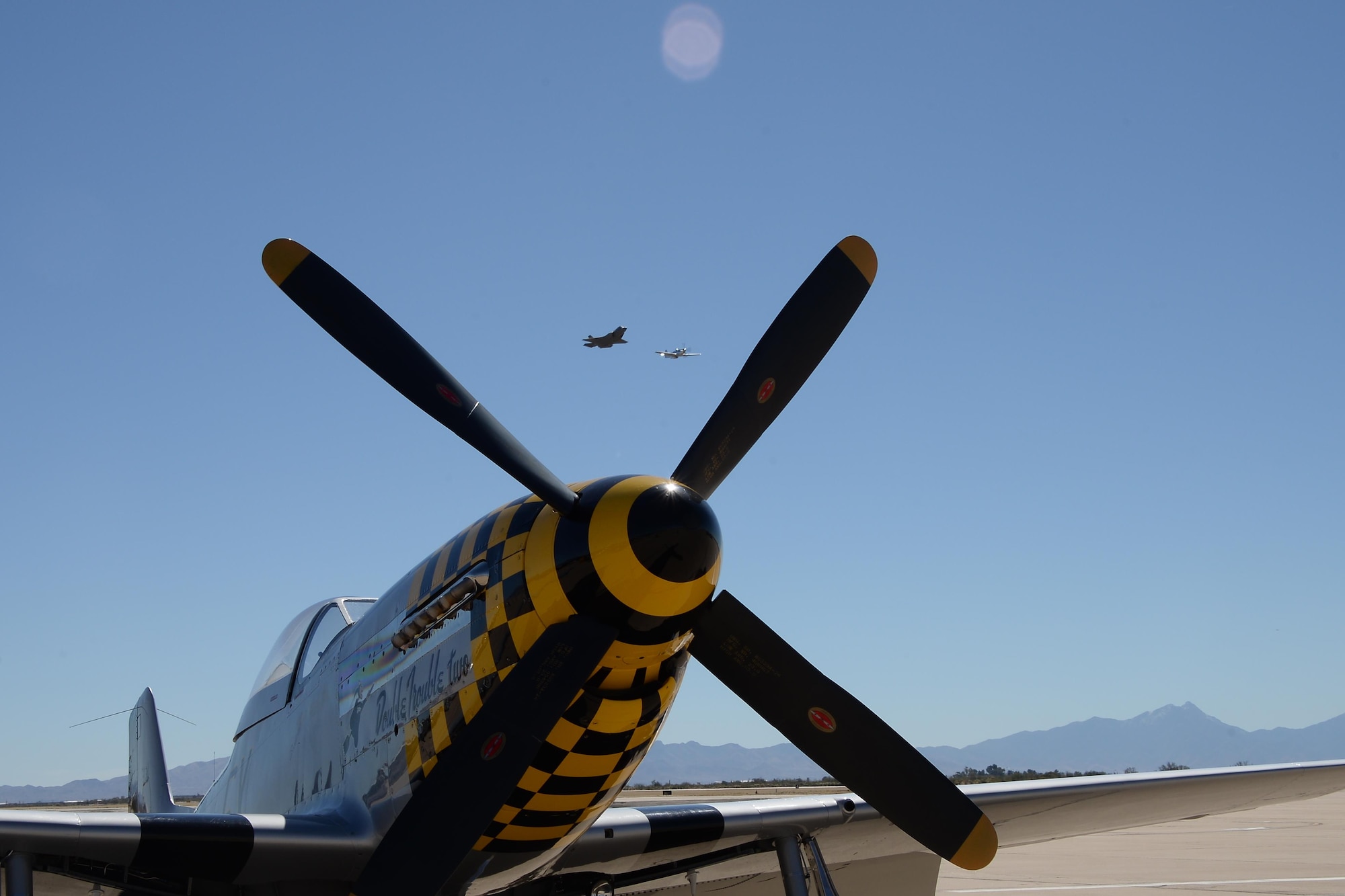 A U.S. Air Force F-35 Lightning II and a P-51 Mustang perform a fly over during the 2017 Heritage Flight Training and Certification Course at Davis-Monthan Air Force Base, Ariz., Feb., 10, 2017. The modern aircraft that participated in this year's HFTCC were the F-35 Lightning II, the F-22 Raptor, F-16 Fighting Falcon and the A-10C Thunderbolt II. The historic aircraft included the P-51 and T-51 Mustangs, the P-40 Warhawk, the P-38 Lightning, the P-47 Thunderbolt, the T-33 Shooting Star and the F-86 Sabre. (U.S. Air Force photo by Senior Airman Ashley N. Steffen)