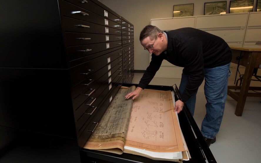 Matt Morris, Air Force Nuclear Weapons Center data manager, locates blueprints of missile field equipment at F.E. Warren Air Force Base, Wyo., Feb. 1, 2017. The document library has files from the intercontinental ballistic missile program’s inception and are still accessed today to troubleshoot problems that can occur to the aging missile system. The Infrastructure and Equipment Division ensures that facility and infrastructure requirements are in place to support the ICBM weapons system across every missile complex. (U.S. Air Force photo by Staff Sgt. Christopher Ruano)
