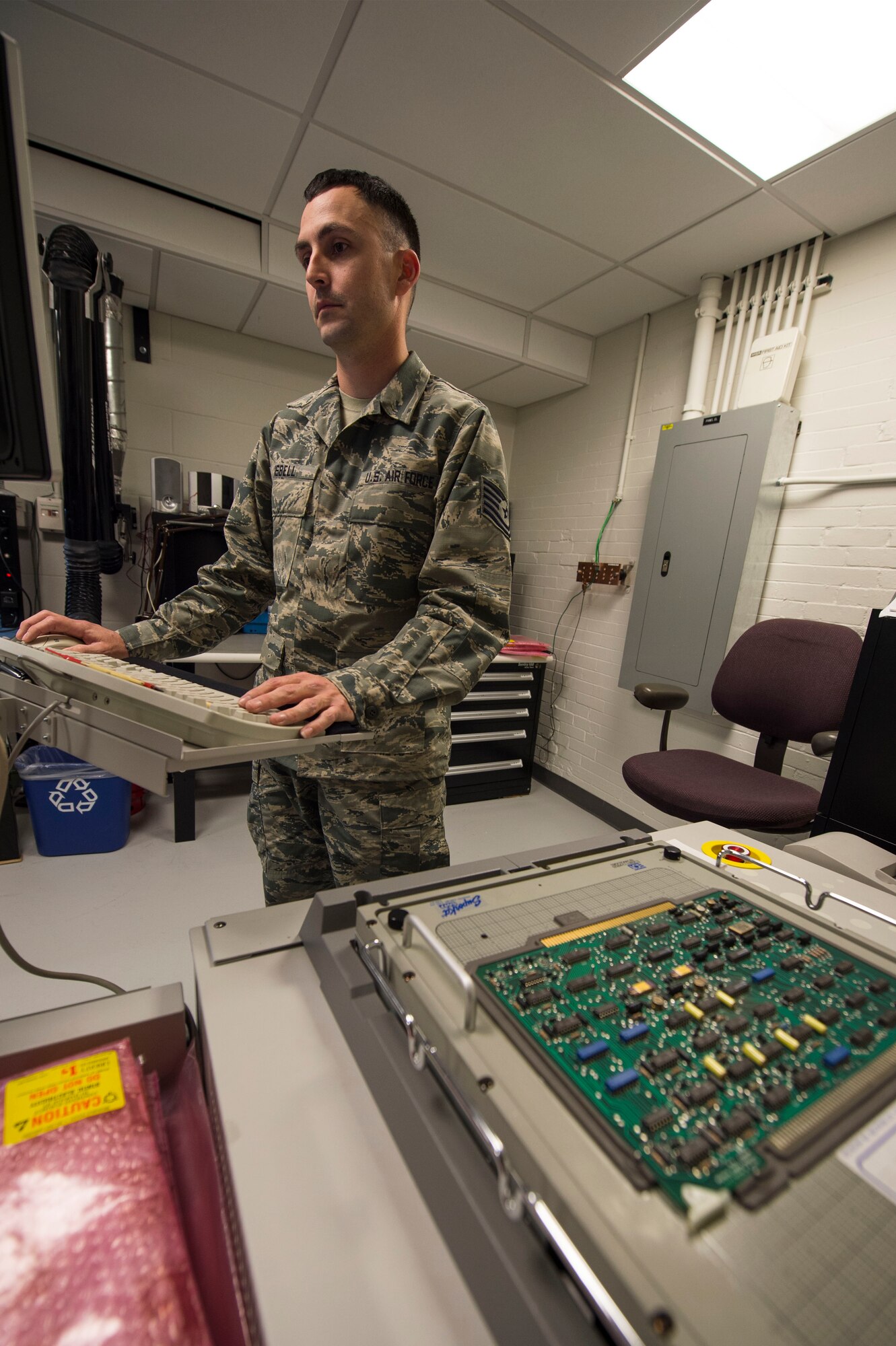 Tech. Sgt. Dustin Isbell, Air Force Nuclear Weapons Center Electronic Laboratory NCO in charge, performs a circuit test on a Minuteman III power processer circuit board at F.E. Warren Air Force Base, Wyo., Feb. 1, 2017. The circuit test ensures the board is in good working order before it is placed back into the missile system. The Infrastructure and Equipment Division ensures that facility and infrastructure requirements are in place to support the intercontinental ballistic missile systems across every missile complex.  (U.S. Air Force photo by Staff Sgt. Christopher Ruano)
