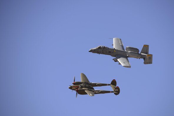 A U.S. Air Force A-10C Thunderbolt II and a P-38 Lightning fly in formation during the 2017 Heritage Flight Training and Certification Course at Davis-Monthan Air Force Base, Ariz., Feb. 10, 2017. Established in 1997, the HFTCC certifies civilian pilots of historic military aircraft and U.S. Air Force pilots to fly in formation together during the upcoming air show season. (U.S. Air Force photo by Senior Airman Betty R. Chevalier)