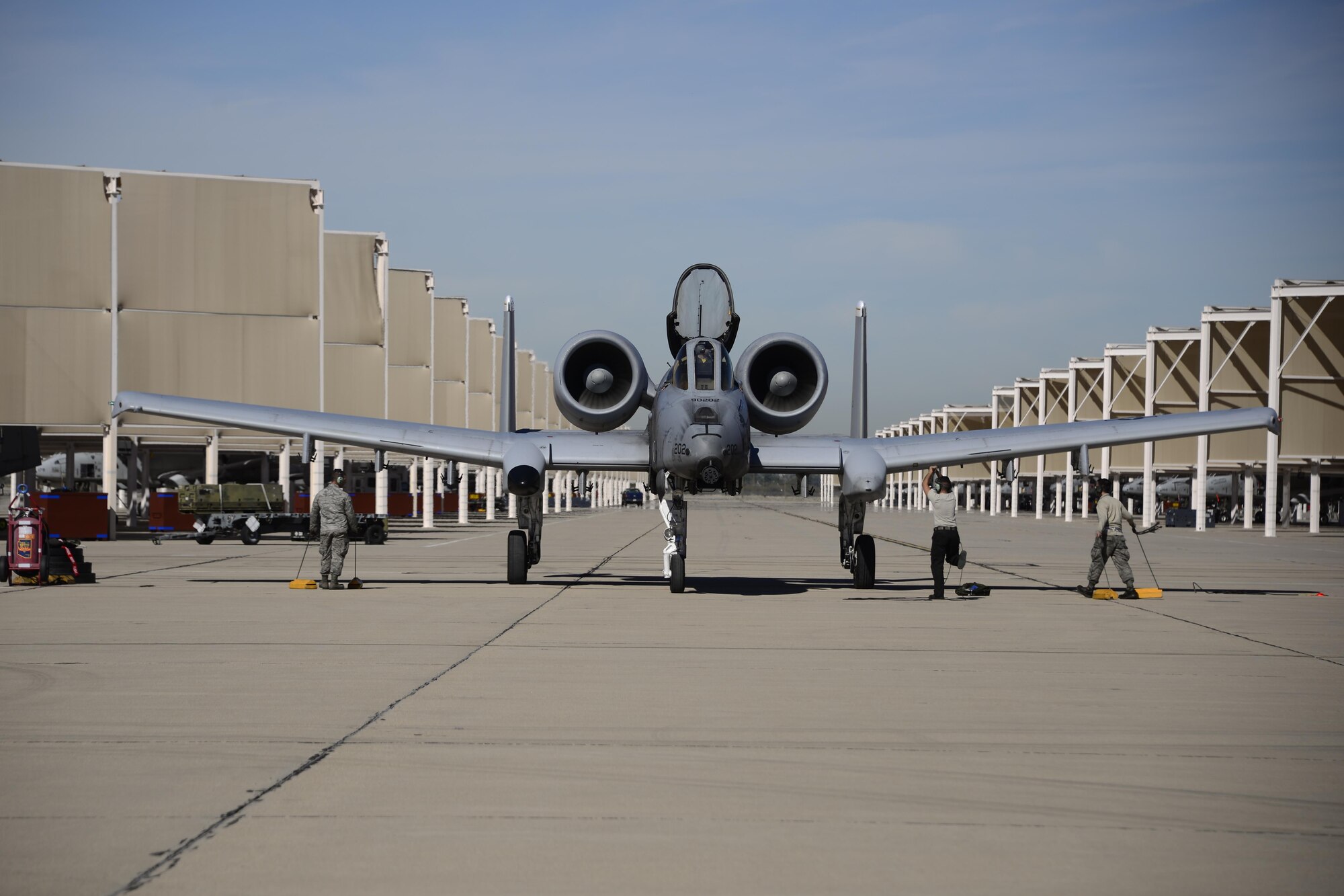 U.S. Airmen recover an A-10C Thunderbolt II during the 2017 Heritage Flight Training and Certification Course at Davis-Monthan Air Force Base, Ariz., Feb. 10, 2017. The annual aerial demonstration training event has been held at D-M since 2001. The course featured aerial demonstrations from historic and modern fighter aircraft. (U.S. Air Force photo by Senior Airman Betty R. Chevalier)