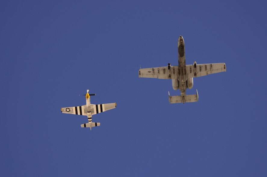 A U.S. Air Force A-10C Thunderbolt II and a P-51 Mustang fly in formation during 2017 Heritage Flight Training and Certification Course at Davis-Monthan Air Force Base, Ariz., Feb. 10, 2017. During the course, aircrews practice ground and flight training to enable civilian pilots of historic military aircraft and U.S. Air Force pilots of current fighter aircraft to fly safely in formations together. (U.S. Air Force photo by Senior Airman Betty R. Chevalier)