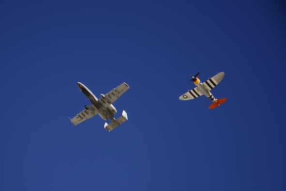 A U.S. Air Force A-10C Thunderbolt II and a P-47 Thunderbolt fly in formation during the 2017 Heritage Flight Training and Certification Course at Davis-Monthan Air Force Base, Ariz., Feb. 10, 2017. The annual aerial demonstration training event has been held at D-M since 2001. The modern aircraft that participated in this year’s HFTCC were the F-35 Lightning II, the F-22 Raptor, F-16 Fighting Falcon and the A-10C Thunderbolt II. The historic aircraft included the P-51 and T-51 Mustangs, the P-40 Warhawk, the P-38 Lightning, the P-47 Thunderbolt, the T-33 Shooting Star and the F-86 Sabre. (U.S. Air Force photo by Senior Airman Betty R. Chevalier)
