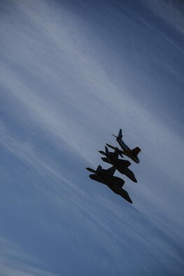 A U.S. Air Force F-22 Raptor, F-35 Lightning II and F-86 Sabre fly in formation during the 2017 Heritage Flight Training and Certification Course at Davis-Monthan Air Force Base, Ariz., Feb. 10, 2017. The 20th annual training event has been held at D-M since 2001 and features aerial demonstrations from historical and modern fighter aircraft. (U.S. Air Force photo by Senior Airman Chris Drzazgowski)