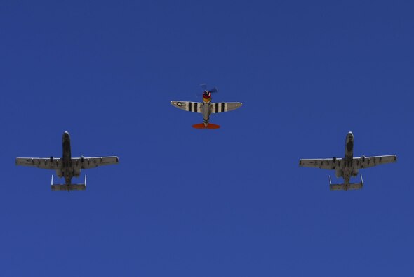 Two U.S. Air Force A-10C Thunderbolt IIs and a P-47 Thunderbolt fly together during the 2017 Heritage Flight Training and Certification Course at Davis-Monthan Air Force Base, Ariz., Feb. 10, 2017. The 20th annual training event has been held at D-M since 2001 and features aerial demonstrations from historical and modern fighter aircraft. (U.S. Air Force photo by Senior Airman Chris Drzazgowski)