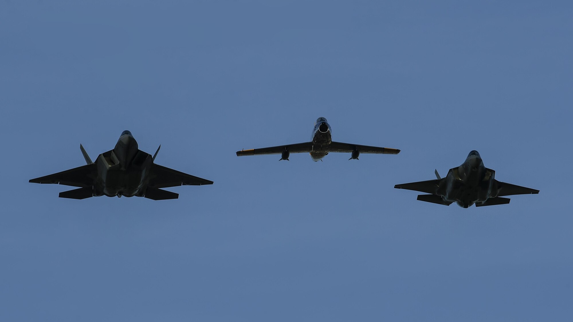 A U.S. Air Force F-22 Raptor, F-35 Lightning II and F-86 Sabre fly in formation during the 2017 Heritage Flight Training and Certification Course at Davis-Monthan Air Force Base, Ariz., Feb. 10, 2017. The 20th annual training event has been held at D-M since 2001 and features aerial demonstrations from historical and modern fighter aircraft. (U.S. Air Force photo by Senior Airman Chris Drzazgowski)